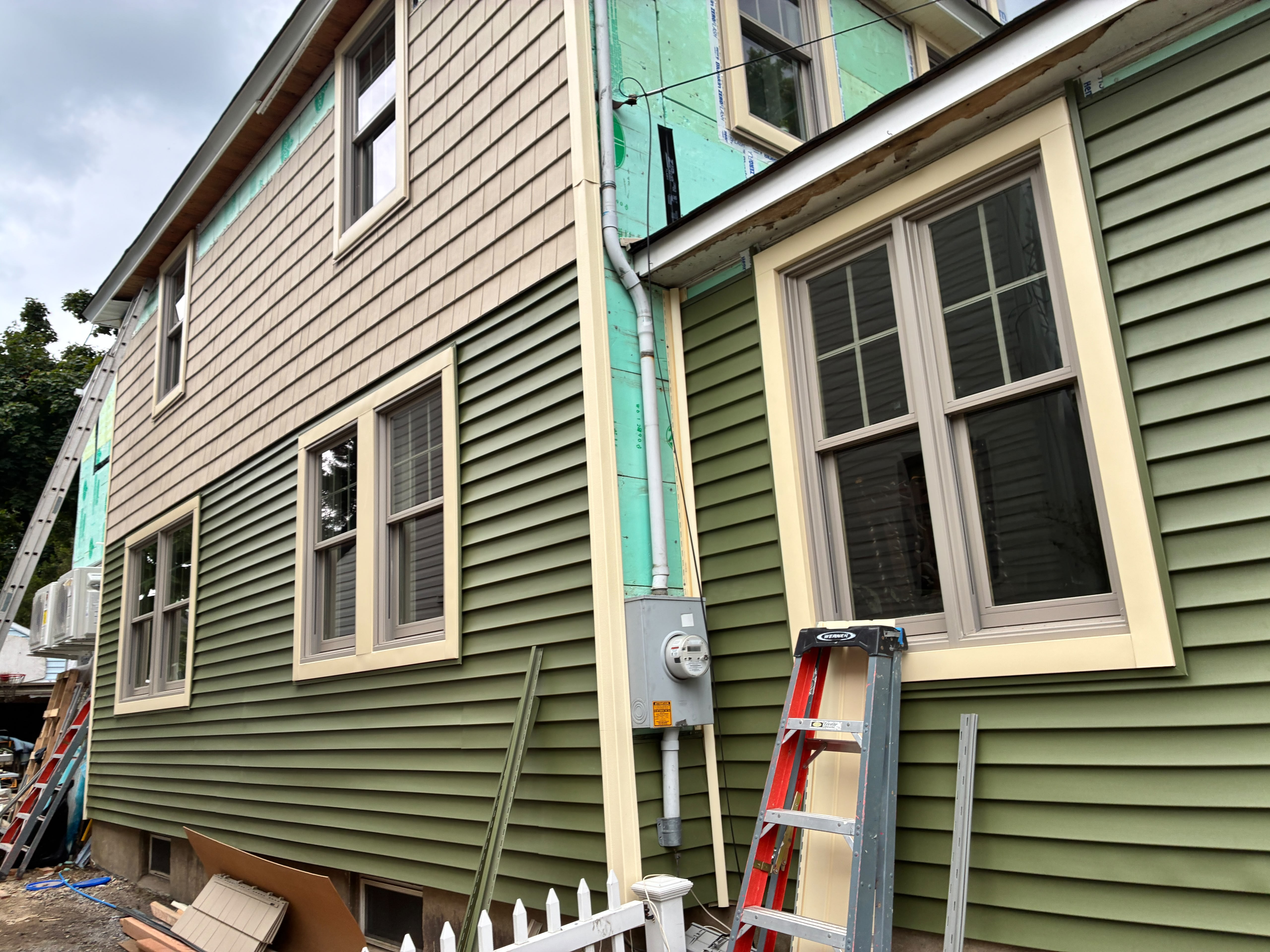 Exterior siding and window installation, from the Anastos Contractors project gallery